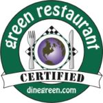 Logo of a certified green restaurant featuring a globe, fork, and knife, promoting environmentally friendly dining practices.